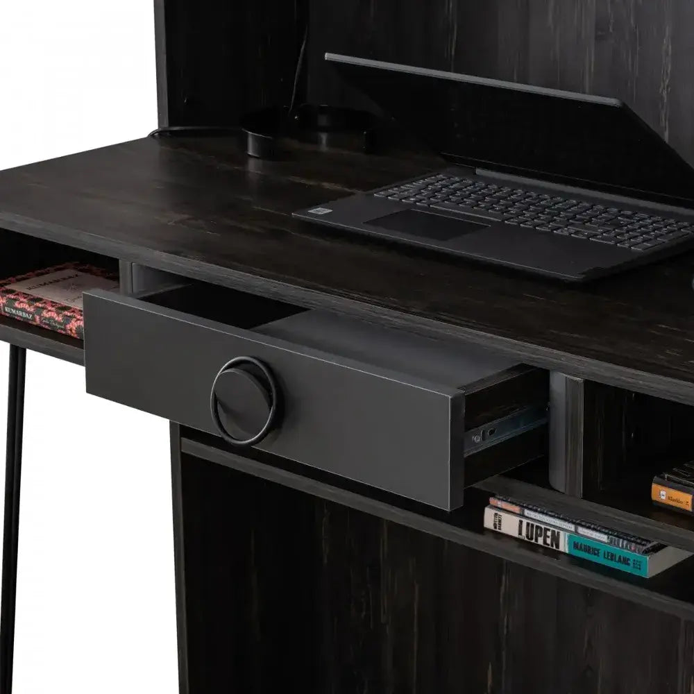 Black Desk with laptop open drawer and books on dark wooden surface for Lynda Kids