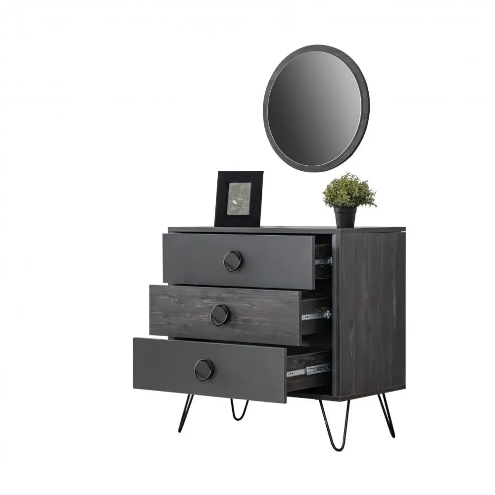 Black Dresser with three drawers, circular pulls, hairpin legs, topped with mirror and plant