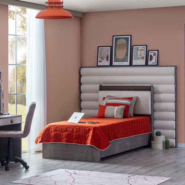 Aura Bed by Lynda Kids with gray upholstered base and extended ribbed headboard