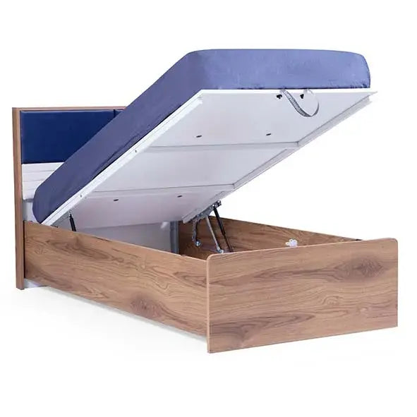 Orion Bed with dark blue upholstered headboard and lift-up storage platform for kids