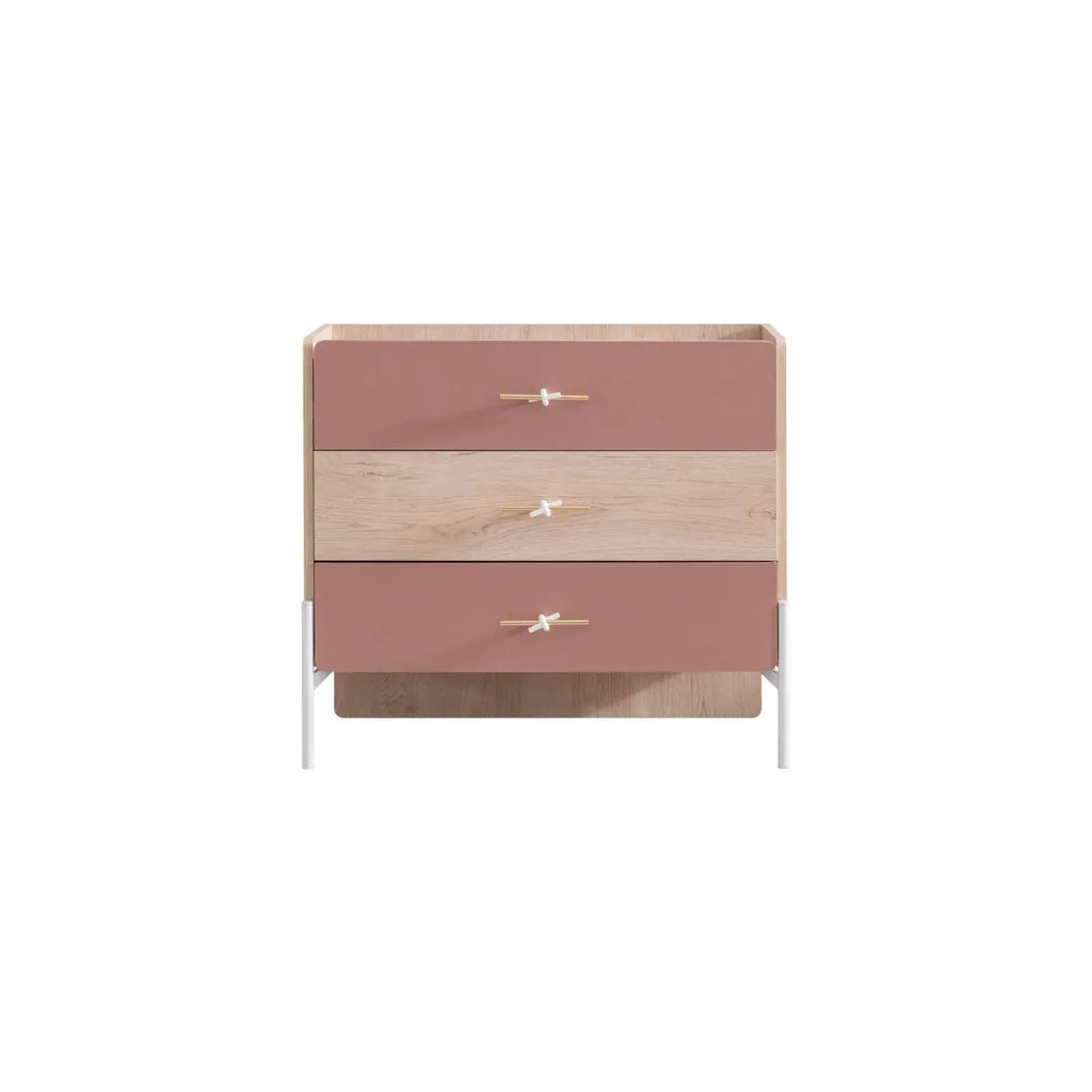 Rosetta Dresser by Lynda Kids with three pink and light wood-grain drawers and white metal legs