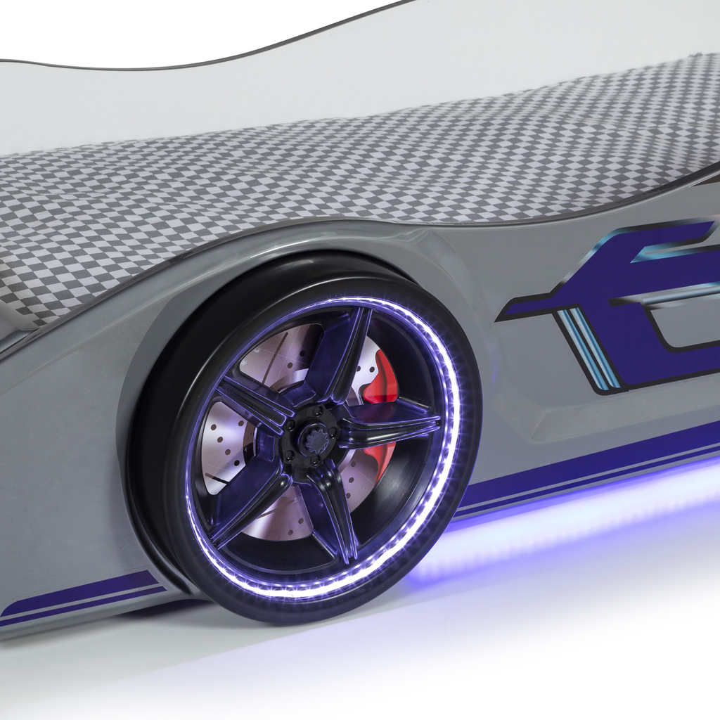 Gray Thunder Racer Bed with checkerboard mattress, illuminated wheels, and purple accents
