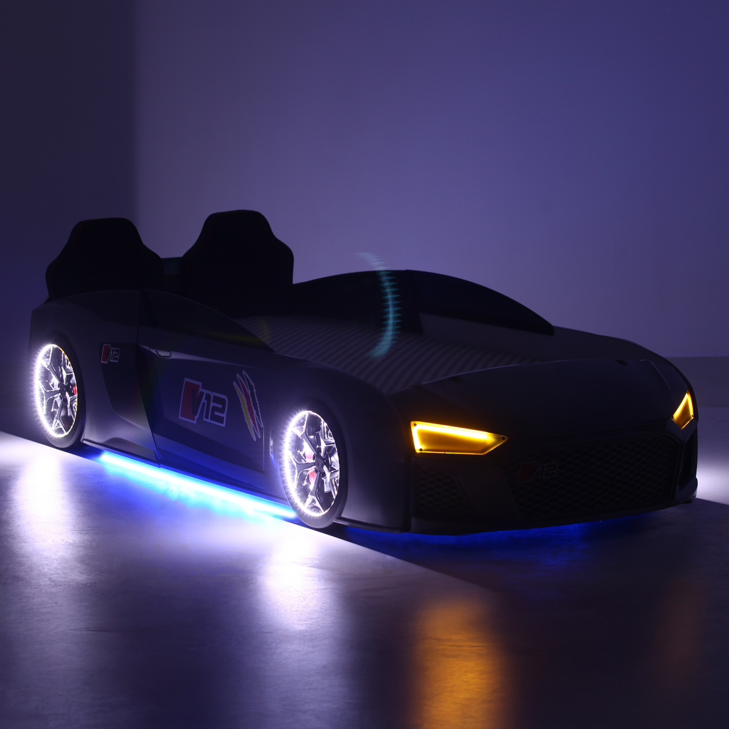 V12 Racer Bed sleek dark car-shaped bed with glowing wheels and illuminated headlights